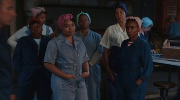 Movie still from “A League of Their Own” (2022), created by Abbi Jacobson – A group of women standing next to each other; Medium shot, Low angle