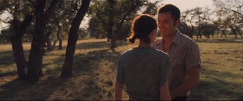 Movie still from “Ain't Them Bodies Saints” (2013), directed by David Lowery – A man and a woman talking in a field; Medium shot, Over the shoulder angle