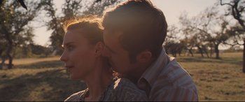 Movie still from “Ain't Them Bodies Saints” (2013), directed by David Lowery – A man and a woman kissing in the sunlight; Close Up shot, Low angle
