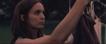 Movie still from “Ain't Them Bodies Saints” (2013), directed by David Lowery – A woman is driving a car in the dark; Close Up shot, Low angle