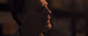Movie still from “Ain't Them Bodies Saints” (2013), directed by David Lowery – A man's face in the dark; Close Up shot, Low angle