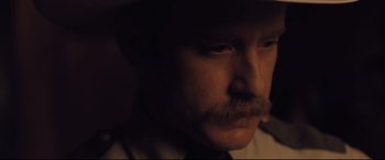 Movie still from “Ain't Them Bodies Saints” (2013), directed by David Lowery – A person wearing a hat; Close Up shot, Over the shoulder angle