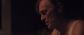 Movie still from “Ain't Them Bodies Saints” (2013), directed by David Lowery – A man's face in the dark; Close Up shot, Low angle