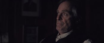 Movie still from “Ain't Them Bodies Saints” (2013), directed by David Lowery – An older man is looking into the distance; Close Up shot, Over the shoulder angle