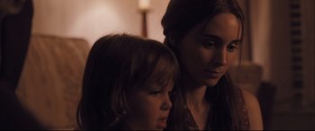 Movie still from “Ain't Them Bodies Saints” (2013), directed by David Lowery – A woman and a young girl looking at the camera; Close Up shot, Over the shoulder angle