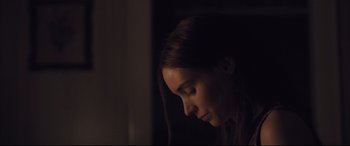 Movie still from “Ain't Them Bodies Saints” (2013), directed by David Lowery – A woman's face in the dark; Close Up shot, Over the shoulder angle