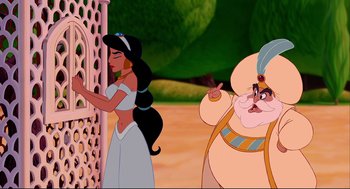 Movie still from “Aladdin” (1992), directed by John Musker – A woman in a white dress and a man in an old man costume; Medium shot, Over the shoulder angle