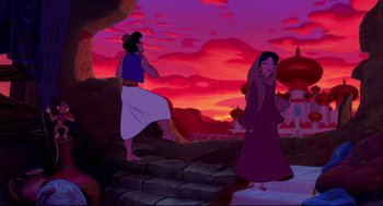 Movie still from “Aladdin” (1992), directed by John Musker – A couple of people standing on some steps in front of a sunset; Wide shot, Over the shoulder angle