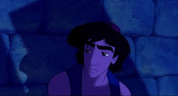 Movie still from “Aladdin” (1992), directed by John Musker – A man with a hat is sitting in the dark; Close Up shot, Overhead angle