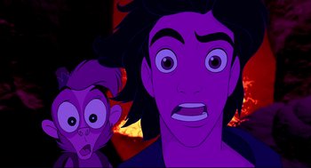 Movie still from “Aladdin” (1992), directed by John Musker – An animated picture of a man and a monkey; Close Up shot, Overhead angle