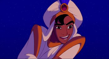 Movie still from “Aladdin” (1992), directed by John Musker – A cartoon character smiling for the camera; Medium shot, Overhead angle