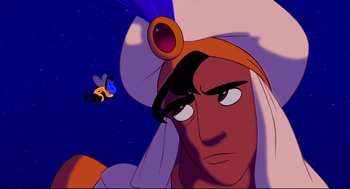 Movie still from “Aladdin” (1992), directed by John Musker – A character from the disney animated film aladdin; Medium shot, Over the shoulder angle