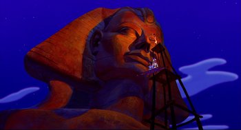 Movie still from “Aladdin” (1992), directed by John Musker – A large statue of a sphinx with a ladder in front of it; Extreme Wide shot, Low angle
