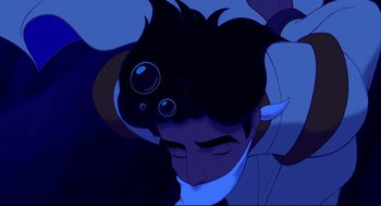 Movie still from “Aladdin” (1992), directed by John Musker – A man with his mouth taped shut and his eyes closed; Close Up shot, Overhead angle