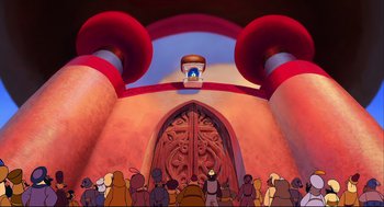 Movie still from “Aladdin” (1992), directed by John Musker – A crowd of people standing in front of a building; Extreme Wide shot, Low angle