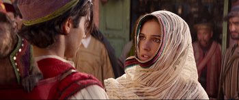 Movie still from “Aladdin” (2019), directed by Guy Ritchie – A man and a woman wearing a headscarf; Close Up shot, Over the shoulder angle