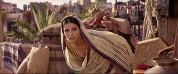 Movie still from “Aladdin” (2019), directed by Guy Ritchie – A beautiful young woman wearing a headscarf; Close Up shot, Low angle