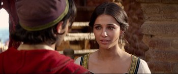 Movie still from “Aladdin” (2019), directed by Guy Ritchie – A young woman is talking to a young man; Close Up shot, Over the shoulder angle