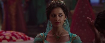Movie still from “Aladdin” (2019), directed by Guy Ritchie – A woman wearing a blue dress and a tiara; Close Up shot, Over the shoulder angle