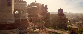 Movie still from “Aladdin” (2019), directed by Guy Ritchie – A view of a city from a roof top; Extreme Wide shot, Low angle