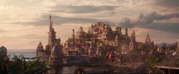Movie still from “Aladdin” (2019), directed by Guy Ritchie – A city with a lot of buildings on top of a hill; Extreme Wide shot, High angle