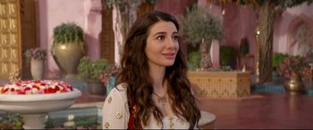 Movie still from “Aladdin” (2019), directed by Guy Ritchie – A beautiful young lady with long brown wavy hair; Close Up shot, Over the shoulder angle