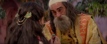 Movie still from “Aladdin” (2019), directed by Guy Ritchie – An old man and a little girl are playing with a ring; Close Up shot, Over the shoulder angle