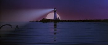 Movie still from “Alaska” (1996), directed by Fraser C. Heston – A light house on a rock in the ocean at night; Extreme Wide shot, Low angle