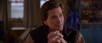 Movie still from “Alaska” (1996), directed by Fraser C. Heston – A person with his hands clasped together; Close Up shot, Over the shoulder angle