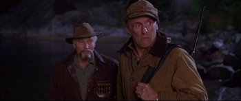 Movie still from “Alaska” (1996), directed by Fraser C. Heston – A couple of men standing next to each other; Medium shot, High angle