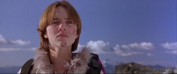 Movie still from “Alaska” (1996), directed by Fraser C. Heston – A young man with red hair is looking into the distance; Close Up shot, Low angle