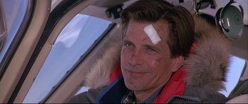 Movie still from “Alaska” (1996), directed by Fraser C. Heston – A person with a bandage on his head; Close Up shot, Low angle