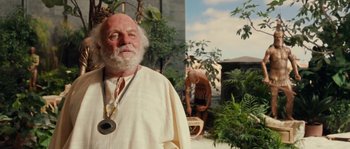 Movie still from “Alexander” (2004), directed by Oliver Stone – An old man with a beard and a white beard; Medium shot, Low angle