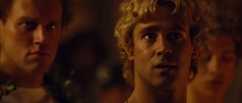 Movie still from “Alexander” (2004), directed by Oliver Stone – A person with blonde curly hair; Close Up shot, Over the shoulder angle