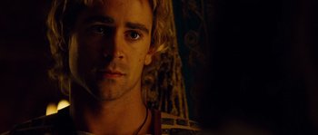 Movie still from “Alexander” (2004), directed by Oliver Stone – A man's face in a dark room; Close Up shot, Over the shoulder angle