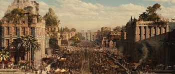 Movie still from “Alexander” (2004), directed by Oliver Stone – An image of a crowd of people walking down the street; Extreme Wide shot, High angle