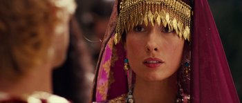 Movie still from “Alexander” (2004), directed by Oliver Stone – A person wearing a headdress; Close Up shot, Over the shoulder angle