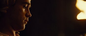 Movie still from “Alexander” (2004), directed by Oliver Stone – A man's face in the dark; Extreme Close Up shot, Low angle