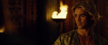 Movie still from “Alexander” (2004), directed by Oliver Stone – A man in front of a fire place; Close Up shot, Over the shoulder angle