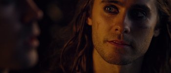 Movie still from “Alexander” (2004), directed by Oliver Stone – A person with long hair; Close Up shot, Overhead angle