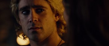 Movie still from “Alexander” (2004), directed by Oliver Stone – A person with long blonde hair; Close Up shot, Over the shoulder angle