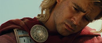 Movie still from “Alexander” (2004), directed by Oliver Stone – A person with long blonde hair; Close Up shot, High angle