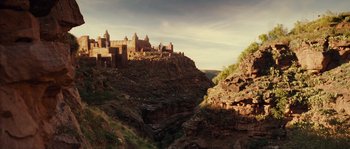 Movie still from “Alexander” (2004), directed by Oliver Stone – A view of a castle on top of a mountain; Extreme Wide shot, High angle