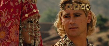 Movie still from “Alexander” (2004), directed by Oliver Stone – A person with long blonde hair; Close Up shot, Over the shoulder angle