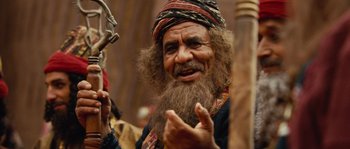 Movie still from “Alexander” (2004), directed by Oliver Stone – An old man with a beard and a hat; Close Up shot, Over the shoulder angle