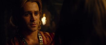 Movie still from “Alexander” (2004), directed by Oliver Stone – A person wearing a red and gold shirt; Close Up shot, Over the shoulder angle