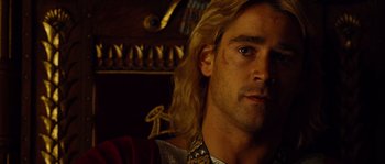 Movie still from “Alexander” (2004), directed by Oliver Stone – A person with long blonde hair; Close Up shot, Over the shoulder angle