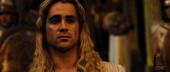 Movie still from “Alexander” (2004), directed by Oliver Stone – A person with long blonde hair; Close Up shot, Low angle