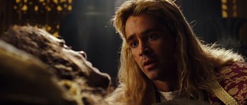 Movie still from “Alexander” (2004), directed by Oliver Stone – A person with long blonde hair; Close Up shot, Over the shoulder angle