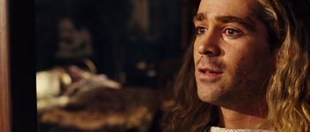 Movie still from “Alexander” (2004), directed by Oliver Stone – A person with long brown hair; Close Up shot, Over the shoulder angle